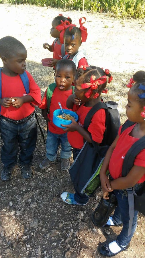 <span class="icon icon--xs icon__camera">  </span> <span class="credit font--s-m upper black"> <b>Smith Family Foundation</b> </span> <div class="caption space-half--right font--s-m gray--med db"> Students attend the first day of school at the School of Flowers in Saint Michel de l’Atalaye, Haiti, built by the Smith Family Foundation. The school was designed to eventually become self-sustaining. </div>