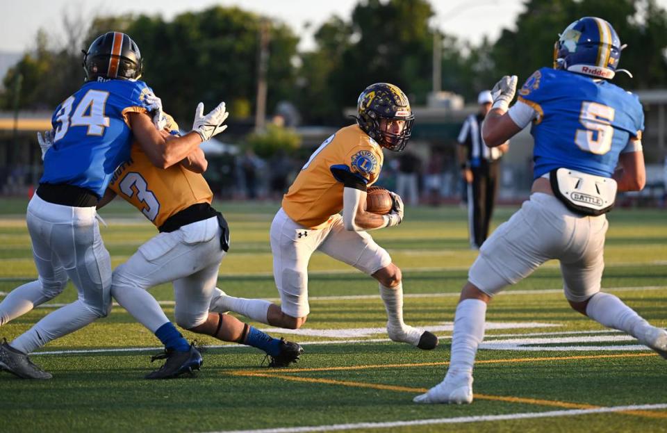 South runner Vincent Lopez (Orestimba) carries the ball after a catch in the Central California Lions All-Star Football Game at Tracy High School in Tracy, Calif., Saturday, June 24, 2023. Andy Alfaro/aalfaro@modbee.com