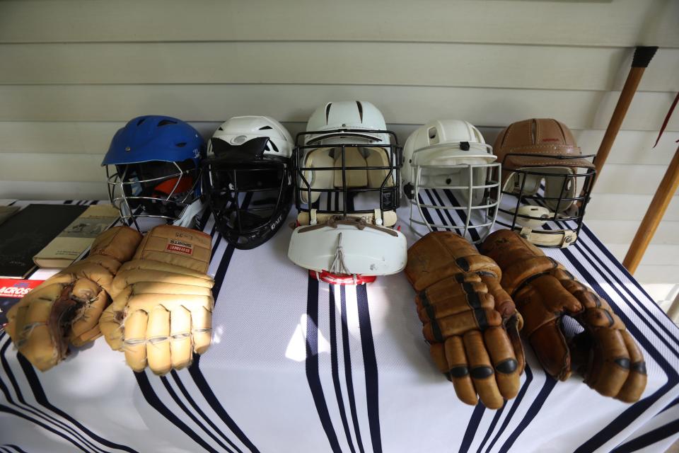 These lacrosse helmets span decades. The one on the far left is from this century, then in descending order they represent 1990s, 1980s, 1970s and 1960s. The last one on the right was a type of helmet that Gary Henry wore when he played lacrosse for Marshall High.