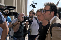 Sea-Watch3 German captain Carola Rackete, second from right, is accompanied by her lawyer Leonardo Marino, right, as she arrives for questioning in court in the southern Sicilian town of Agrigento, Italy, Thursday, July 18, 2019. Rackete, who forced a government block docking at an Italian port after rescuing migrants, faces questioning by Italian prosecutors over allegedly aiding illegal immigration. (Pasquale Claudio Montana Lampo/ANSA via AP)