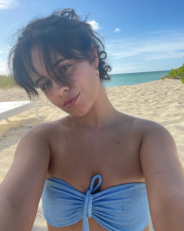 <p>Camila Cabello reached new levels of hot girl summer, posting a totally beautiful make-up free beach selfie from her recent holiday. Cabello looked fresh faced and stunning in a pale blue bandeau bikini, with a messy updo and make-up free skin.</p><p><a href="https://www.instagram.com/p/CSSPNOIp4mw/" rel="nofollow noopener" target="_blank" data-ylk="slk:See the original post on Instagram;elm:context_link;itc:0;sec:content-canvas" class="link ">See the original post on Instagram</a></p>