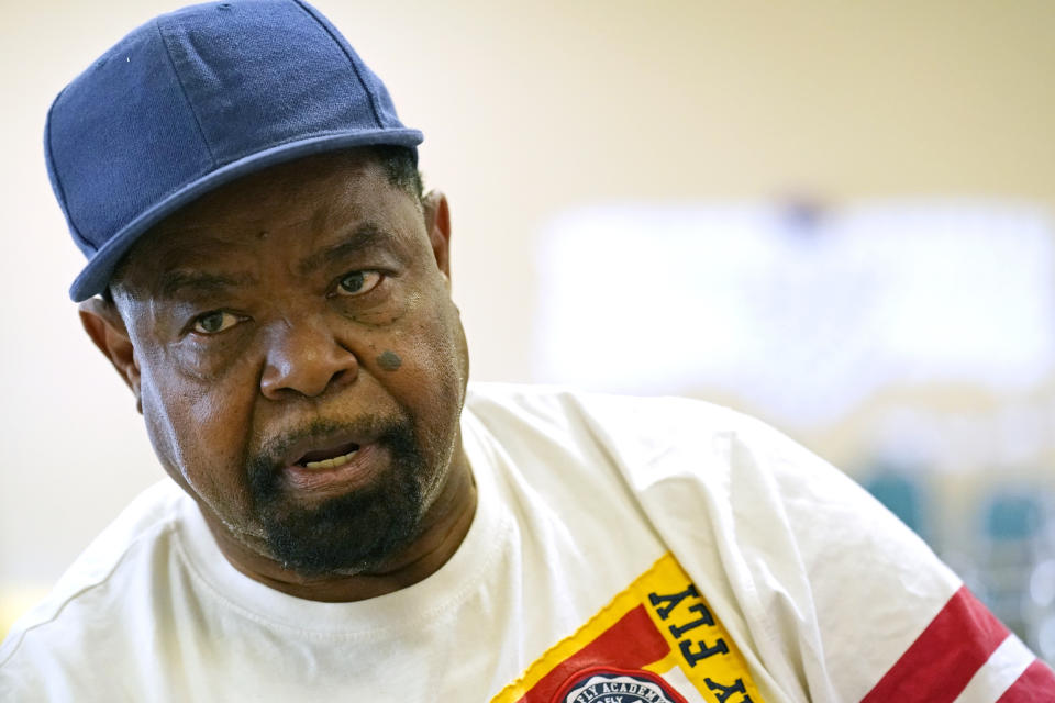 Wilbert Marshall, 71, speaks about his receiving the COVID-19 vaccine, while waiting for a transportation bus at the Rev. S.L.A. Jones Activity Center for the Elderly to take him and other seniors to the Aaron E. Henry Community Health Service Center to receive their vaccinations, Wednesday, April 7, 2021, in Clarksdale, Miss. The Mississippi Department of Human Services is in the initial stages of teaming up with community senior services statewide to help older residents get vaccinated. (AP Photo/Rogelio V. Solis)