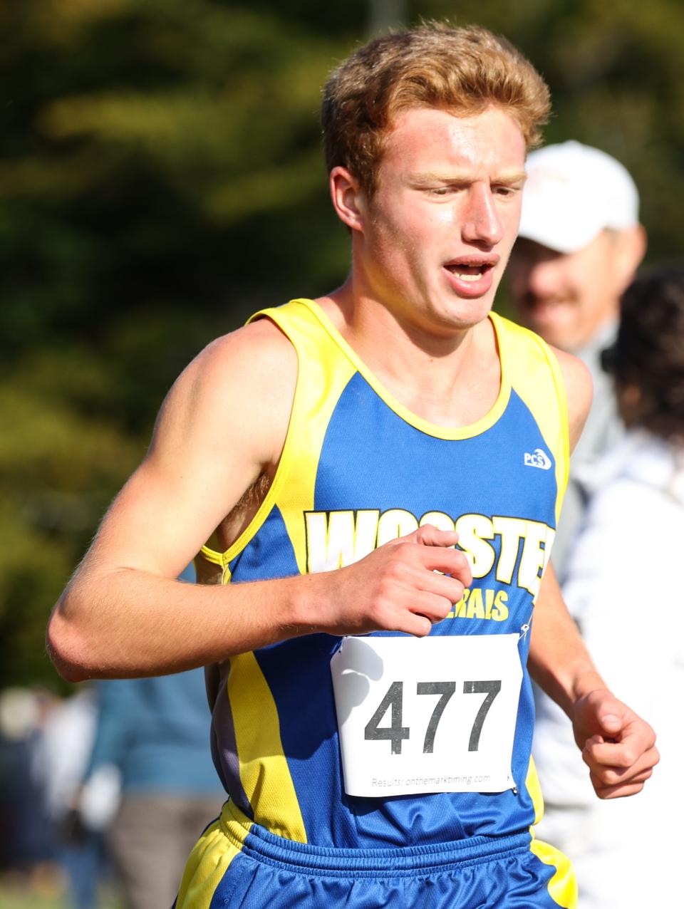 Wooster's Ethan Keating is close on West Holmes' Zeke Galbraith's heels here coming out of the woods portion of the Wayne-Holmes Invitational.