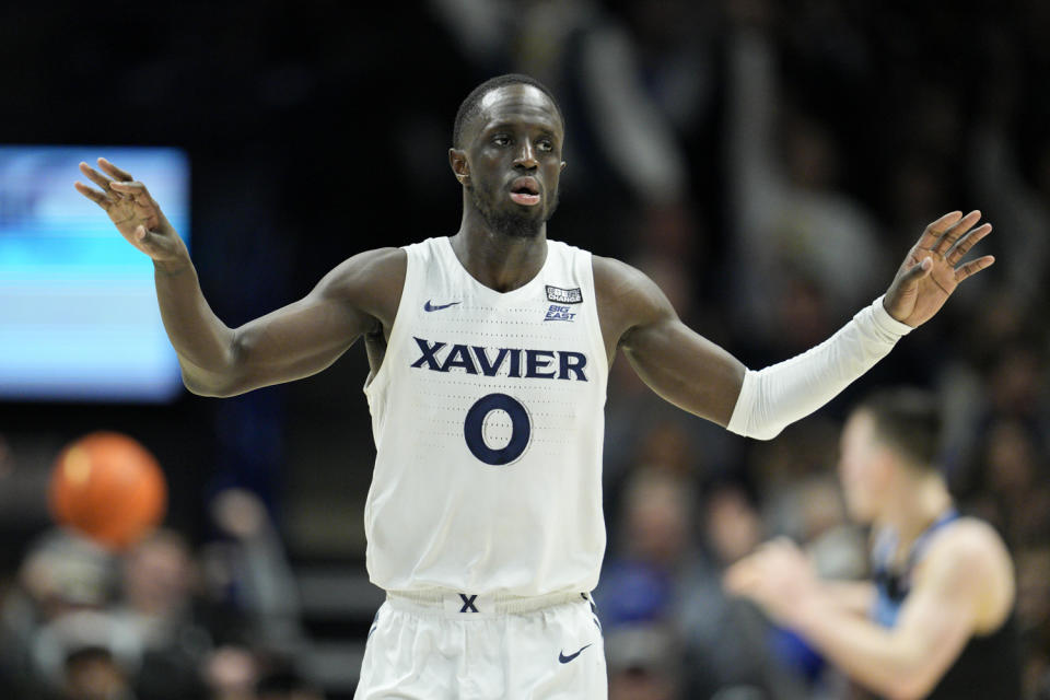 Xavier guard Souley Boum reacts after scoring during the second half of an NCAA college basketball game against Marquette, Sunday, Jan. 15, 2023, in Cincinnati. (AP Photo/Jeff Dean)