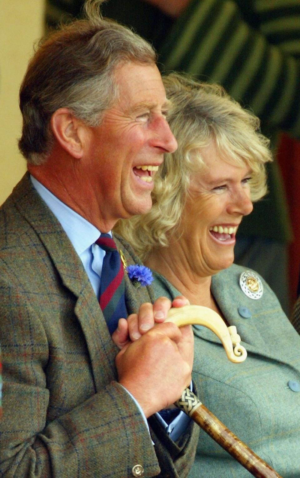 King Charles III and Camilla Parker Bowles laugh in 2004.