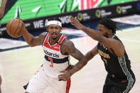 Washington Wizards guard Bradley Beal (3) dribbles the ball against Memphis Grizzlies forward Justise Winslow (7) during the second half of an NBA basketball game, Tuesday, March 2, 2021, in Washington. (AP Photo/Nick Wass)