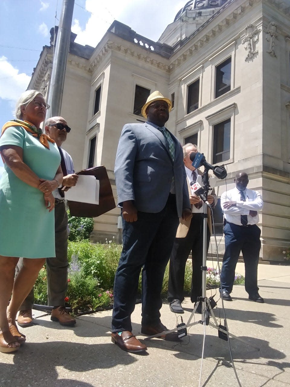 Katharine Liell and Vauhxx Booker address a small group of people during a press conference Aug. 2 at the Monroe County Courthouse.