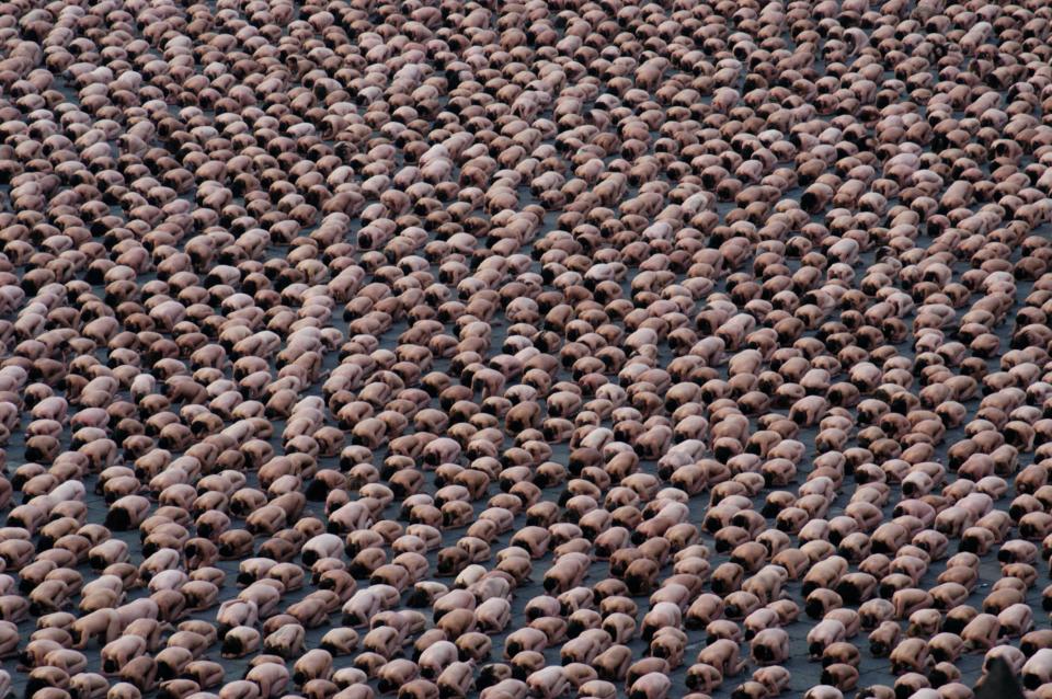 Volunteer models kneel in Mexico City’s Zocalo Plaza as they pose for Tunick on May 6, 2007. About 18,000 people participated in the shoot, smashing Tunick’s previous record of 7,000 nudes, set in 2003 in Barcelona, Spain.