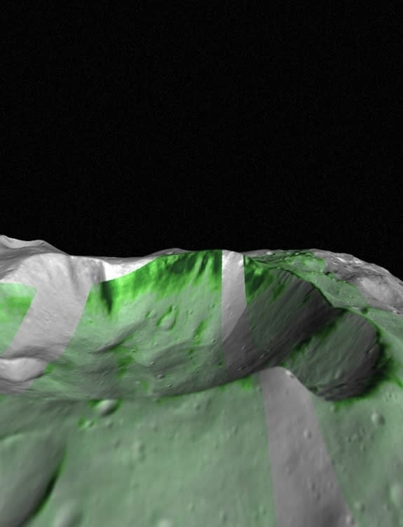 Olivine, a mineral commonly found in mantle rocks, has been detected on Vesta by NASA's Dawn spacecraft. Olivine outcrops within Bellicia crater are shown in deep green. The Infrared hyperspectral images are projected on Vesta combining imaging