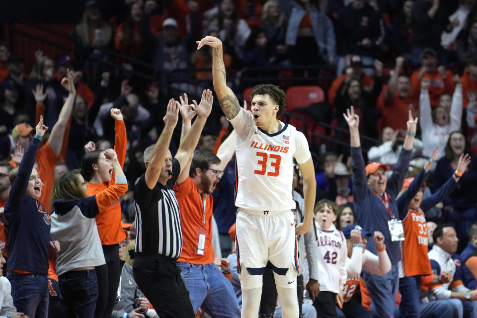 Illinois' Coleman Hawkins celebrates his 3-point basket during second half of an NCAA college basketball game against Nebraska Sunday, Feb. 4, 2024, in Champaign, Ill. (AP Photo/Charles Rex Arbogast)