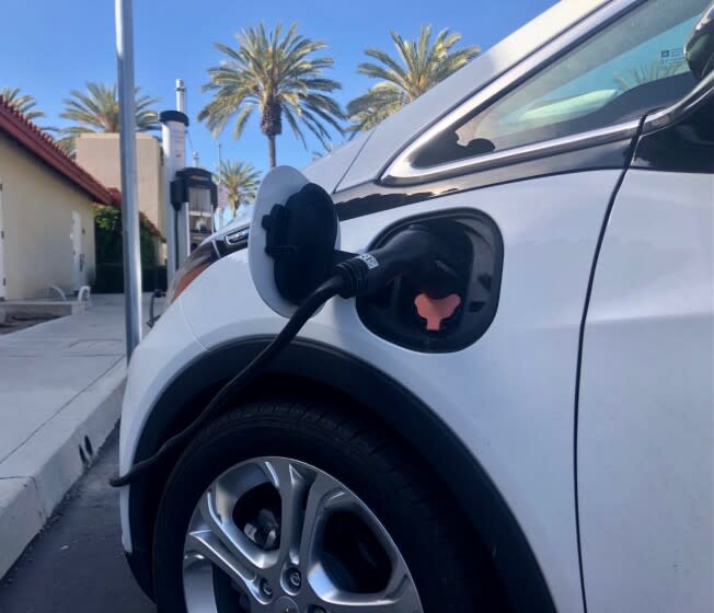 An electric vehicle at a charging station in Chula Vista in March 2021.