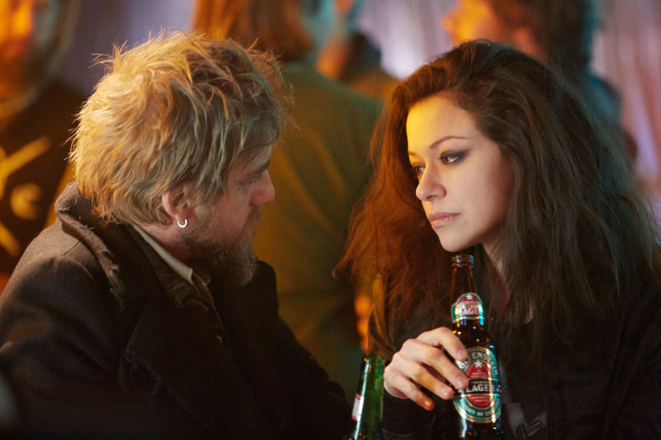 Joel Thomas Hynes and Tatiana Maslany (as Sarah) look at each other intensely