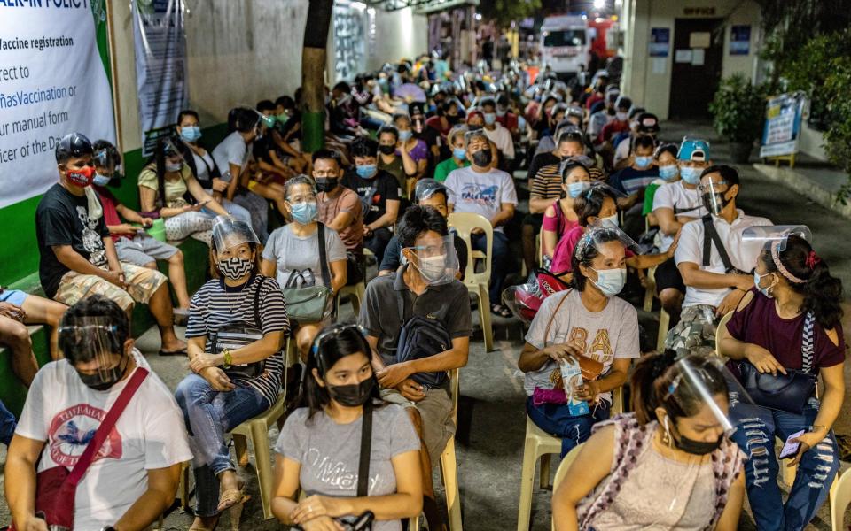People in a queue in the Philippines hoping to get vaccinated amid the spread of the delta variant - Ezra Acayan/Getty Images