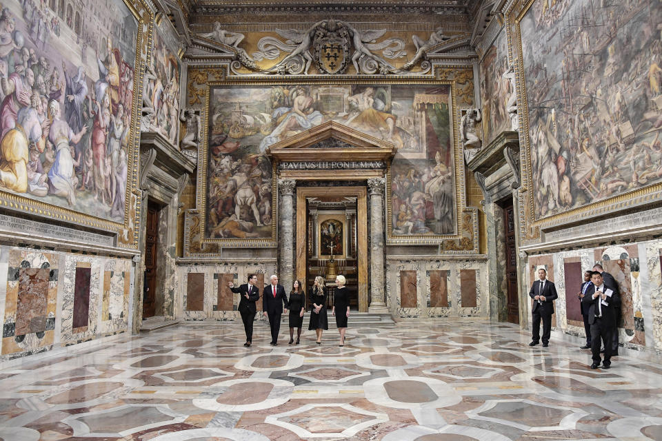 US Vice President Mike Pence, second from left, and part of his delegation are given a private tour of the Vatican after his private audience with Pope Francis, at the Vatican, Friday, Jan. 24, 2020. The pontiff and the vice president had a private hour-long conservation. (Alessandro Di Meo/Pool Photo via AP)