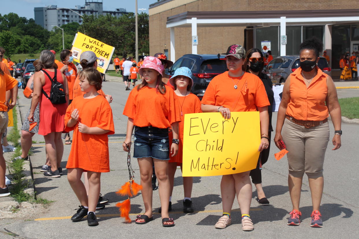 BRANFORD, CANADA - JULY 01: People take part in a tribute march to the Mohawk Institute residential school, organized by Brantford Regional Indigenous Support Centre, for children who lost their lives while staying in residential schools, on July 01, 2021 in Branford, Ontario, Canada. (Photo by Seyit Aydogan/Anadolu Agency via Getty Images)