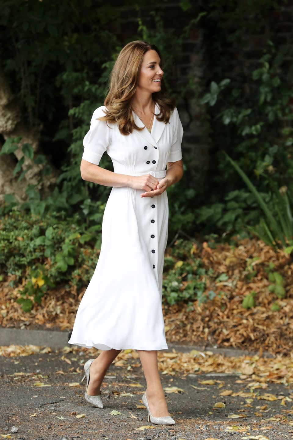 <p>While visiting the charity, Baby Basic UK & Baby Basics Sheffield, Kate re-wore a crisp, white shirtdress by Suzannah, which she previously sported for <a href="https://www.townandcountrymag.com/society/tradition/a28258730/kate-middleton-white-dress-wimbledon-2019/" rel="nofollow noopener" target="_blank" data-ylk="slk:last year's Wimbledon match;elm:context_link;itc:0;sec:content-canvas" class="link ">last year's Wimbledon match</a>. When the Duchess entered the charity, she donned a <a href="https://www.townandcountrymag.com/society/tradition/g32616136/queen-elizabeth-princess-charlotte-royal-family-liberty-of-london-print-photos/" rel="nofollow noopener" target="_blank" data-ylk="slk:liberty print;elm:context_link;itc:0;sec:content-canvas" class="link ">liberty print</a> face mask. </p>