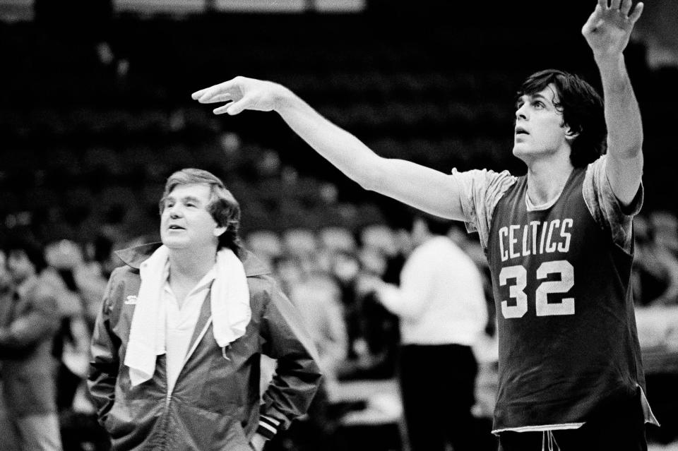 Boston Celtics Kevin McHale takes a pointer from Celtics head coach Bill Fitch during practice Monday afternoon at Boston Garden, May 4, 1981. The Celtics downed the Philadelphia 76ers 91-90. The Celtics will now meet with the Houston Rockets in a best-of-seven series for the National Basketball Association hampionship title. The first games open in Boston Tuesday night. (AP Photo/Benoit).