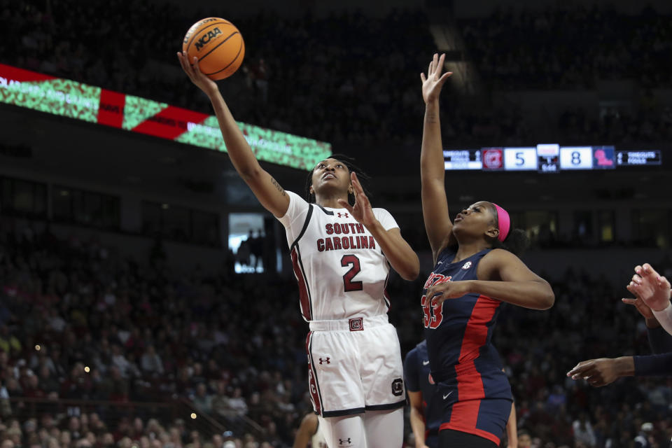 South Carolina forward Ashlyn Watkins (2) scores inside over Mississippi forward Kharyssa Richardson (33) during the first half of an NCAA college basketball game Sunday, Feb. 4, 2024, in Columbia, S.C. (AP Photo/Artie Walker Jr.)