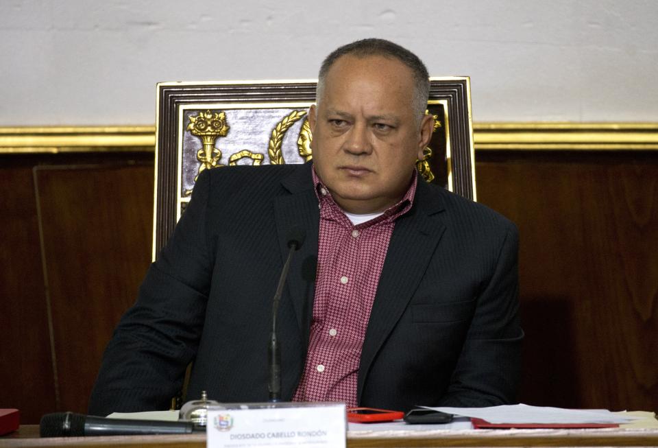 Diosdado Cabello, Venezuela's socialist party boss and president of the National Constituent Assembly attends a session in Caracas, Venezuela, Tuesday, April 2, 2019. Lawmakers loyal to President Nicolas Maduro considered whether to strip National Assembly leader Juan Guaido of immunity on Tuesday in a move that would pave the way to prosecute and potentially arrest him for allegedly violating the constitution after declaring himself interim president. (AP Photo/Ariana Cubillos)