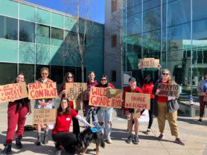 University of Alaska graduate student workers hold signs in support of a contract in Anchorage, Alaska, on April 29, 2024. (Photo provided by Alaska Graduate Workers Association)