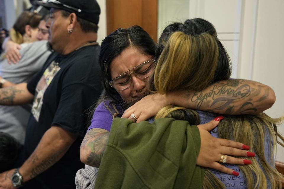 Family members of the victims of the Uvalde shootings react after a Texas House committee voted to take up a bill to limit the age for purchasing AR-15 style weapons in the full House in Austin, Texas, Monday, May 8, 2023. (AP Photo/Eric Gay)