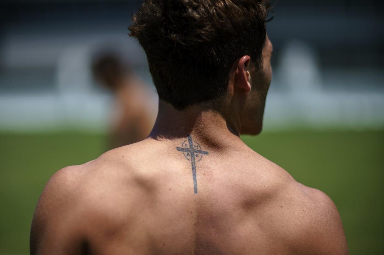 Argentina's Rodrigo Isgro walks off the field after a men's rugby sevens practice at the Tokyo Olympics in 2020. <a href="https://newsroom.ap.org/detail/TokyoOlympicsRugby/08268c36670c40a083e3fd00b36bbf89/photo?Query=olympics%20tattoo&mediaType=photo&sortBy=creationdatetime:desc&dateRange=Anytime&totalCount=523&currentItemNo=54" rel="nofollow noopener" target="_blank" data-ylk="slk:AP Photo/David Goldman;elm:context_link;itc:0;sec:content-canvas" class="link ">AP Photo/David Goldman</a>