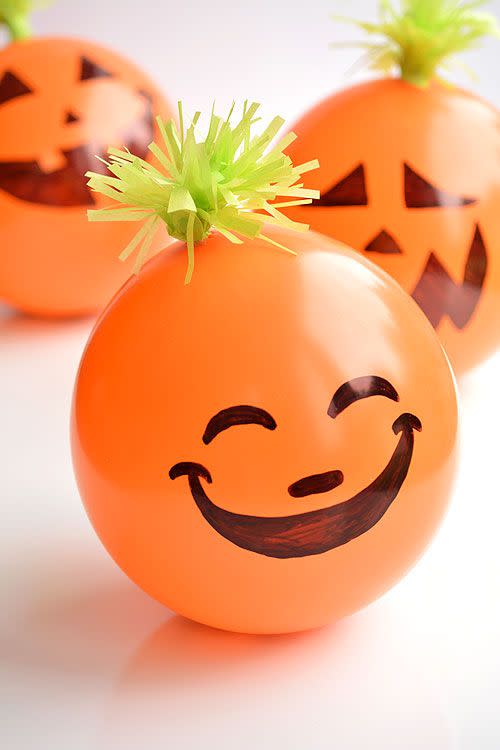 <p>Just like piñatas, these adorable balloons are filled with treats and ready to burst open. Youngsters can take turns popping the pumpkins, or they can take them home as party favors.</p><p><strong>Get the tutorial at <a href="https://onelittleproject.com/candy-filled-balloon-pumpkins/" rel="nofollow noopener" target="_blank" data-ylk="slk:One Little Project;elm:context_link;itc:0;sec:content-canvas" class="link ">One Little Project</a>.</strong></p><p><strong><a class="link " href="https://www.amazon.com/Creative-Balloons-12-Latex-Decorator/dp/B01LBUA3HW?tag=syn-yahoo-20&ascsubtag=%5Bartid%7C10050.g.3476%5Bsrc%7Cyahoo-us" rel="nofollow noopener" target="_blank" data-ylk="slk:SHOP ORANGE BALLOONS;elm:context_link;itc:0;sec:content-canvas">SHOP ORANGE BALLOONS</a><br></strong></p>