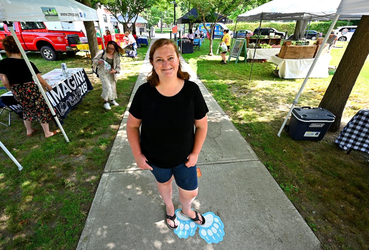 Grace Sliwoski, director of programs for the Regional Environmental Council, at the REC Farmers Market at University Park.