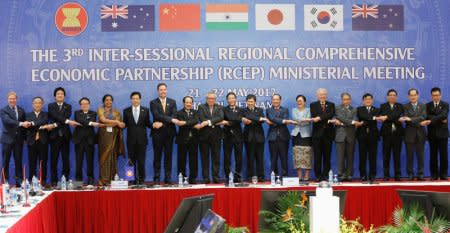 Trade ministers pose for a photo during the 3rd Inter-sessional Regional Comprehensive Economic Partnership (RCEP) Ministerial Meeting in Hanoi, Vietnam May 22, 2017. REUTERS/Kham