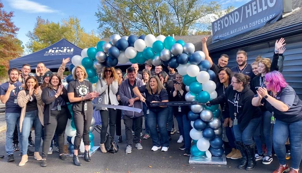 Jennifer Freeby, general manager for the Stroudsburg's Beyond/Hello medical marijuana dispensary, cuts the ribbon during the grand opening on Wednesday, Oct. 27, 2021.