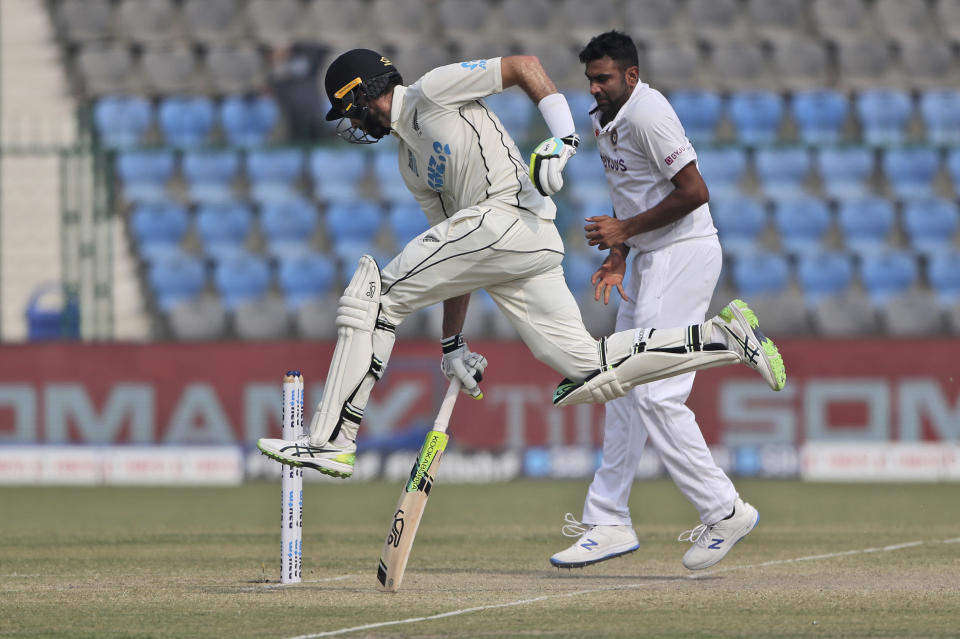 New Zealand's William Somerville leaps as he completes a run during the day five of their first test cricket match with India in Kanpur, India, Monday, Nov. 29, 2021. (AP Photo/Altaf Qadri)