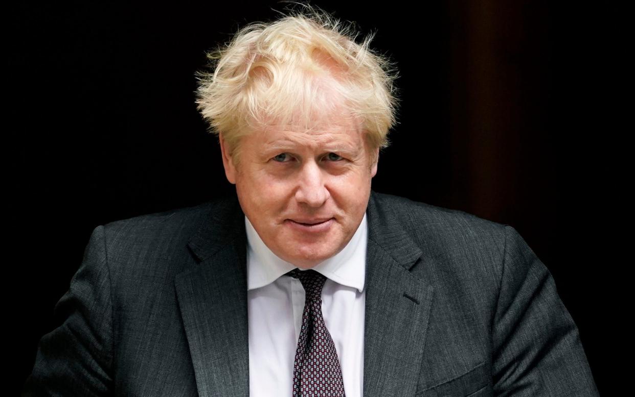 Boris Johnson leaves 10 Downing Street as he makes his way to Parliament to attend the weekly Prime Minister Questions session - Alberto Pezzali/AP