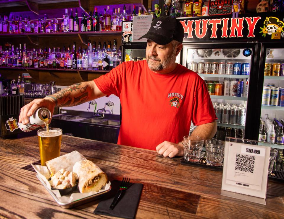 General Manager Sam Betty suggests paring one of the signature sandwiches of the bar, the chopped cheese goagie, with a Narragansett Lager from Rhode Island. Mutiny Ocala is a music bar (punk & hard rock) focusing on live shows, hot dogs, hoagies, beers and booze. The bar opened in September 2021 at 46 S. Magnolia Ave. in downtown Ocala. It serves both drinks and food and is open seven days a week: Sunday through Thursday from 2 p.m. to midnight and Friday and Saturday from 2 p.m. to 2 a.m.