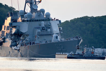 FILE PHOTO: The U.S. Navy Arleigh Burke-class guided-missile destroyer USS Fitzgerald returns to Fleet Activities (FLEACT) Yokosuka following a collision with a merchant vessel while operating southwest of Yokosuka, Japan in photo received June 17, 2017. Courtesy of U.S. Navy/Mass Communication Specialist 1st Class Peter Burghart/Handout via REUTERS/File Photo