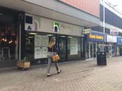 A woman passes by the Hanley Economic Building Society branch in Stoke-on-Trent