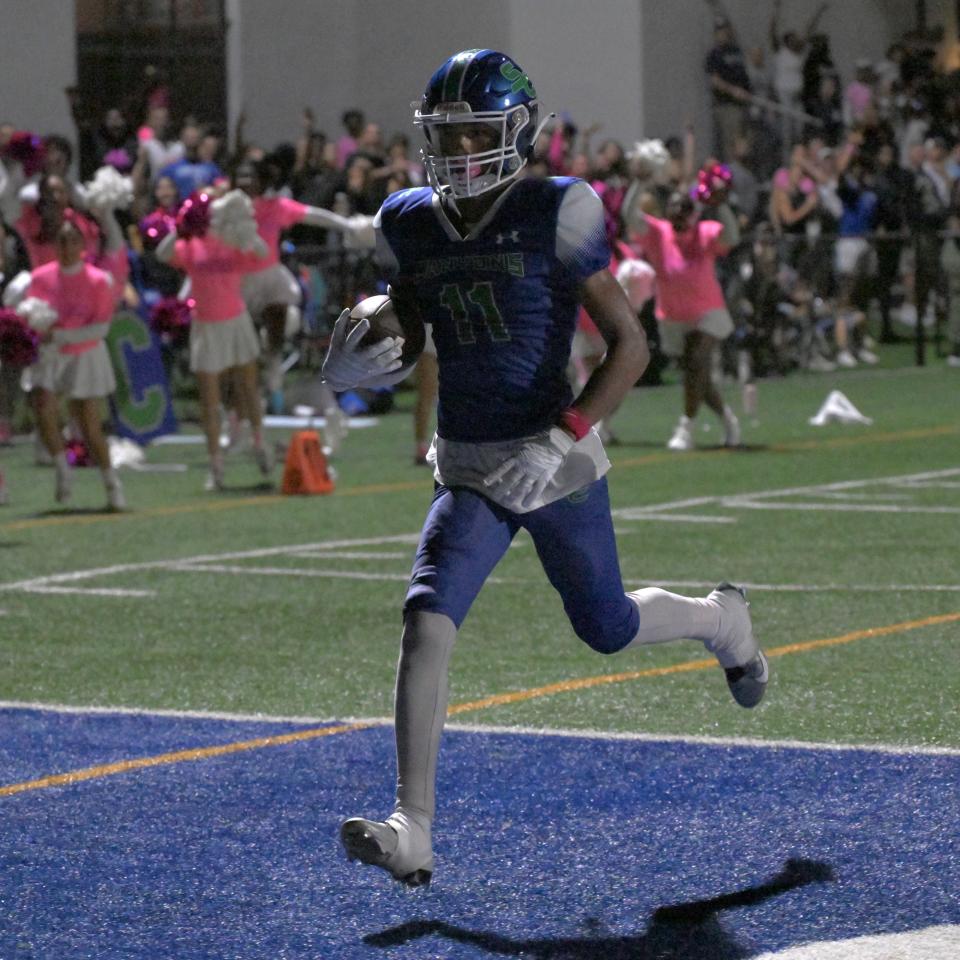 Somerset's Tayegan Briskey walks into the end zone after securing a catch off a flea-flicker trick play before the halftime whistle on Oct. 13, 2023.