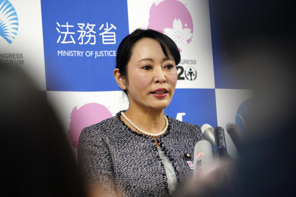 Japanese Justice Minister Masako Mori speaks about Nissan's former chairman Carlos Ghosn during a press conference at her ministry in Tokyo Thursday, Jan. 9, 2020. Mori is denouncing Ghosn's criticism of the nation's criminal justice system. Mori said she wanted to prevent his spreading an "erroneous" understanding abroad about Japan's system. Ghosn, who skipped bail while awaiting trial here, said in Beirut that Japan's system was unfair and rigged. (AP Photo/Eugene Hoshiko)