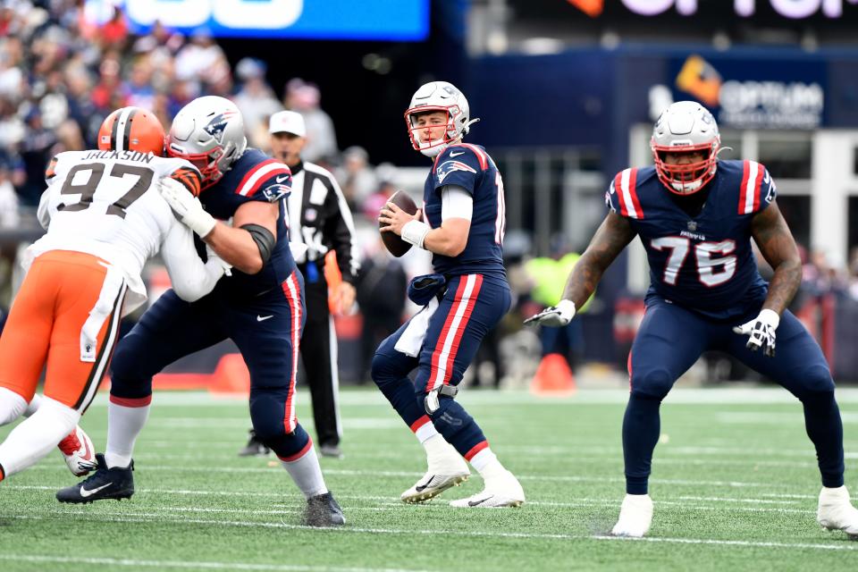 New England Patriots quarterback Mac Jones looks to throw against the Cleveland Browns during the first half of a game on Sunday, Nov. 14, 2021, at Gillette Stadium in Foxboro.