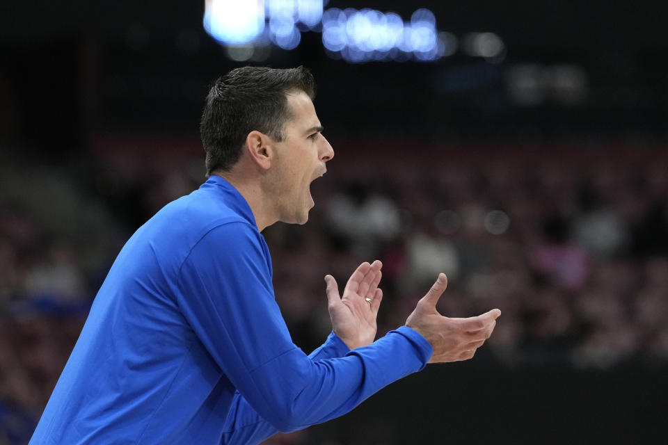 Florida coach Todd Golden applauds during the second half of the team's NCAA college basketball game against Richmond in the Orange Bowl Classic, Saturday, Dec. 9, 2023, in Sunrise, Fla. (AP Photo/Lynne Sladky)