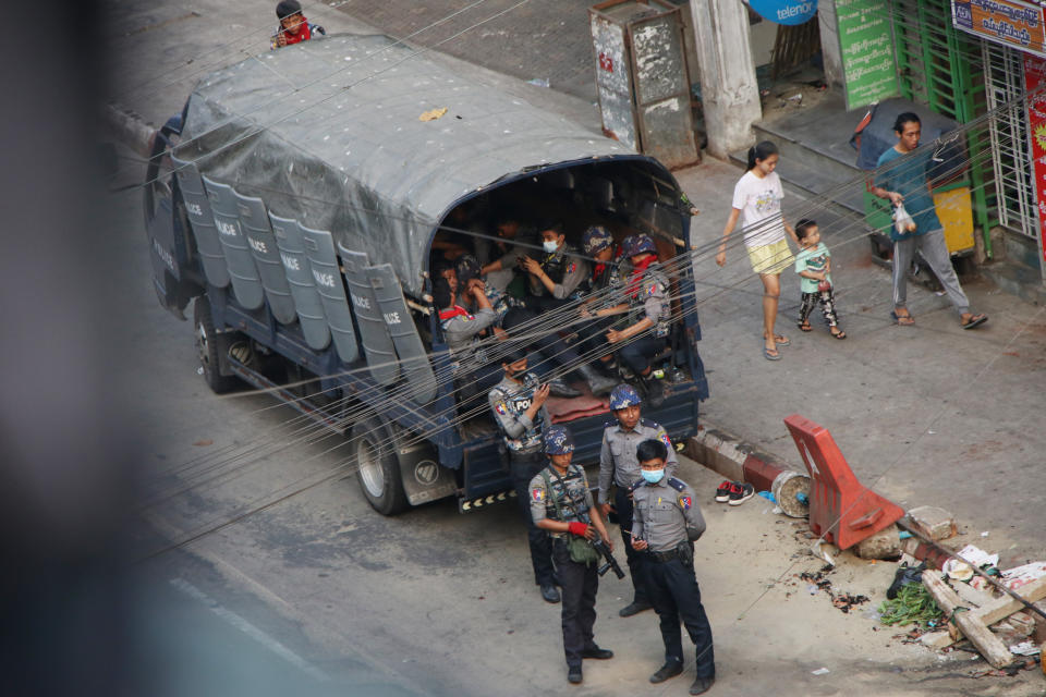 Security forces stand by on Hledan road in Kamayut township of Yangon in Myanmar, Monday, March 29, 2021. Over 100 people across the country were killed by security forces on Saturday alone, including several children. Myanmar aircraft also carried out three strikes along the country's border overnight Sunday, according to a member of the Free Burma Rangers, a humanitarian relief agency that delivers medical and other assistance to villagers. (AP Photo)