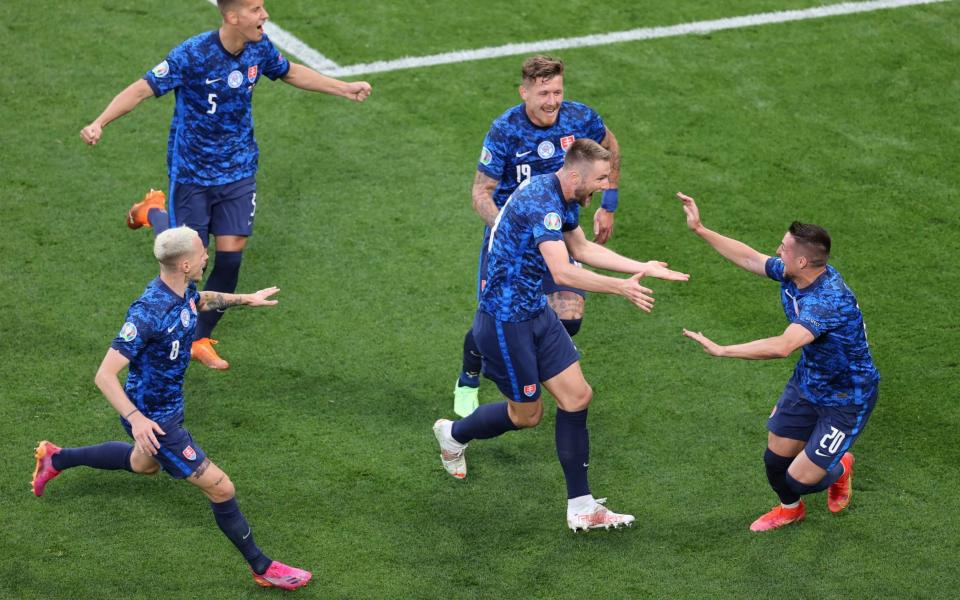 Milan Skriniar celebrates with his teammates after making it 2-1 to Slovakia in the second half - REUTERS
