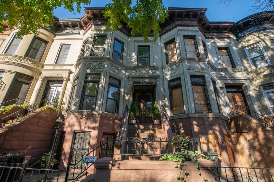 Gated front steps lead up to the home of Brianna Suggs in Crown Heights, Brooklyn, which FBI agents raided on 2 November (Associated Press)