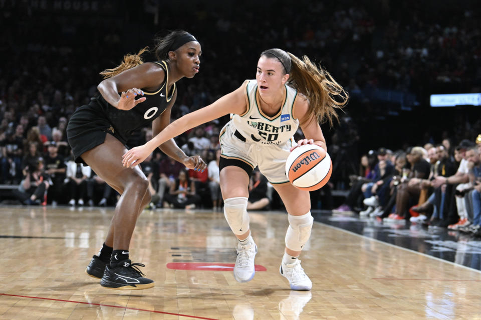 New York Liberty guard <a class="link " href="https://sports.yahoo.com/wnba/players/6358" data-i13n="sec:content-canvas;subsec:anchor_text;elm:context_link" data-ylk="slk:Sabrina Ionescu;sec:content-canvas;subsec:anchor_text;elm:context_link;itc:0">Sabrina Ionescu</a> (20) dribbles past Las Vegas Aces guard <a class="link " href="https://sports.yahoo.com/wnba/players/6018" data-i13n="sec:content-canvas;subsec:anchor_text;elm:context_link" data-ylk="slk:Jackie Young;sec:content-canvas;subsec:anchor_text;elm:context_link;itc:0">Jackie Young</a> (0) in the first half during game two of the 2023 WNBA Finals at Michelob Ultra Arena. Mandatory Credit: Candice Ward-USA TODAY Sports