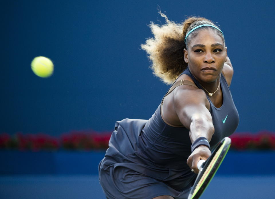 Serena Williams, of the United States, returns the ball to Ekaterina Alexandrova, of Russia, during the Rogers Cup women’s tennis tournament Thursday, Aug. 8, 2019, in Toronto. (Nathan Denette/The Canadian Press via AP)