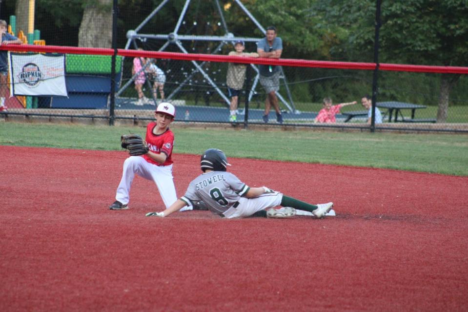 Dover 11U's Camden Stowell slides into second base during a 14-8 win over host New Canaan, Connecticut, Thursday, July 21, 2022, in the Cal Ripken New England regional tournament semifinals.