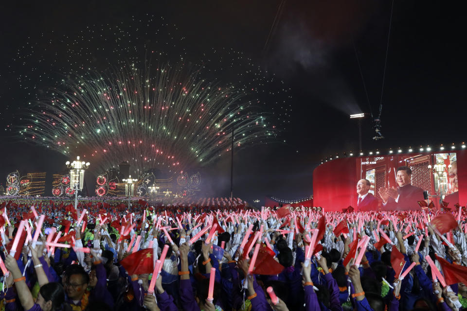 Chinese President Xi Jinping is displayed on a screen as he applauds during the gala evening held on Tiananmen Square for the 70th anniversary of the founding of the People's Republic of China in Beijing on Tuesday, Oct. 1, 2019. Tiananmen Square is both where leader Mao Zedong declared the founding of the People's Republic of China in 1949 and where pro-democracy protesters rallied in 1989 before being quashed by the military in a bloody crackdown. (AP Photo/Ng Han Guan)