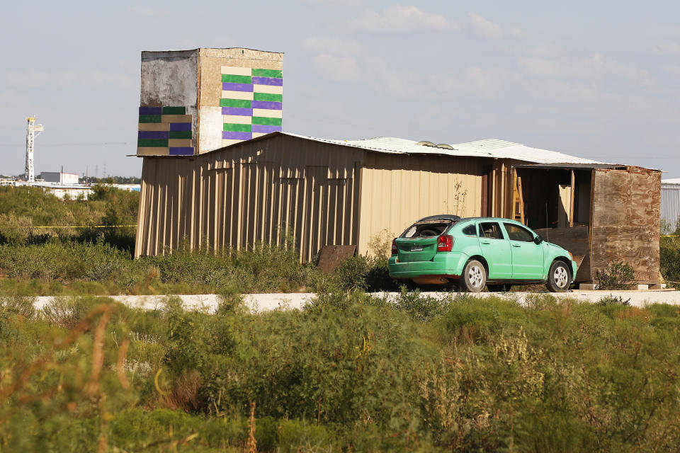 A drilling rig can be seen behind the home of Seth Ator, the alleged gunman in a West Texas rampage Saturday, on Monday, Sept. 2, 2019, near Odessa, Texas. (AP Photo/Sue Ogrocki)