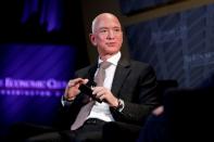 FILE PHOTO: Jeff Bezos, president and CEO of Amazon and owner of The Washington Post, speaks at the Economic Club of Washington DC's "Milestone Celebration Dinner" in Washington