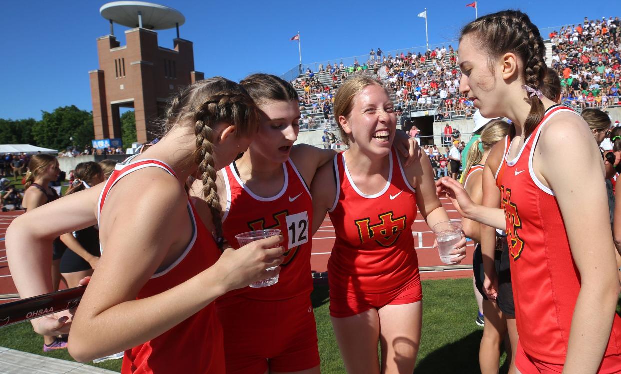 Worthington Christian's 3,200-meter relay of Ellie Cain, Sydney Diedrich, Zoe Ward and Natalie Ryan share a moment after their race in the Division III state meet June 3 at Ohio State.