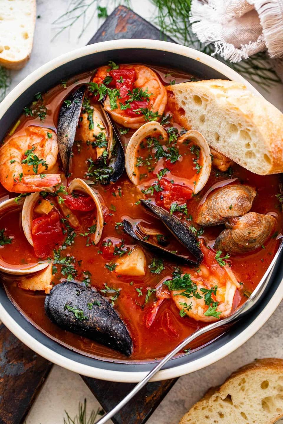 Seafood stew with bread on the side.